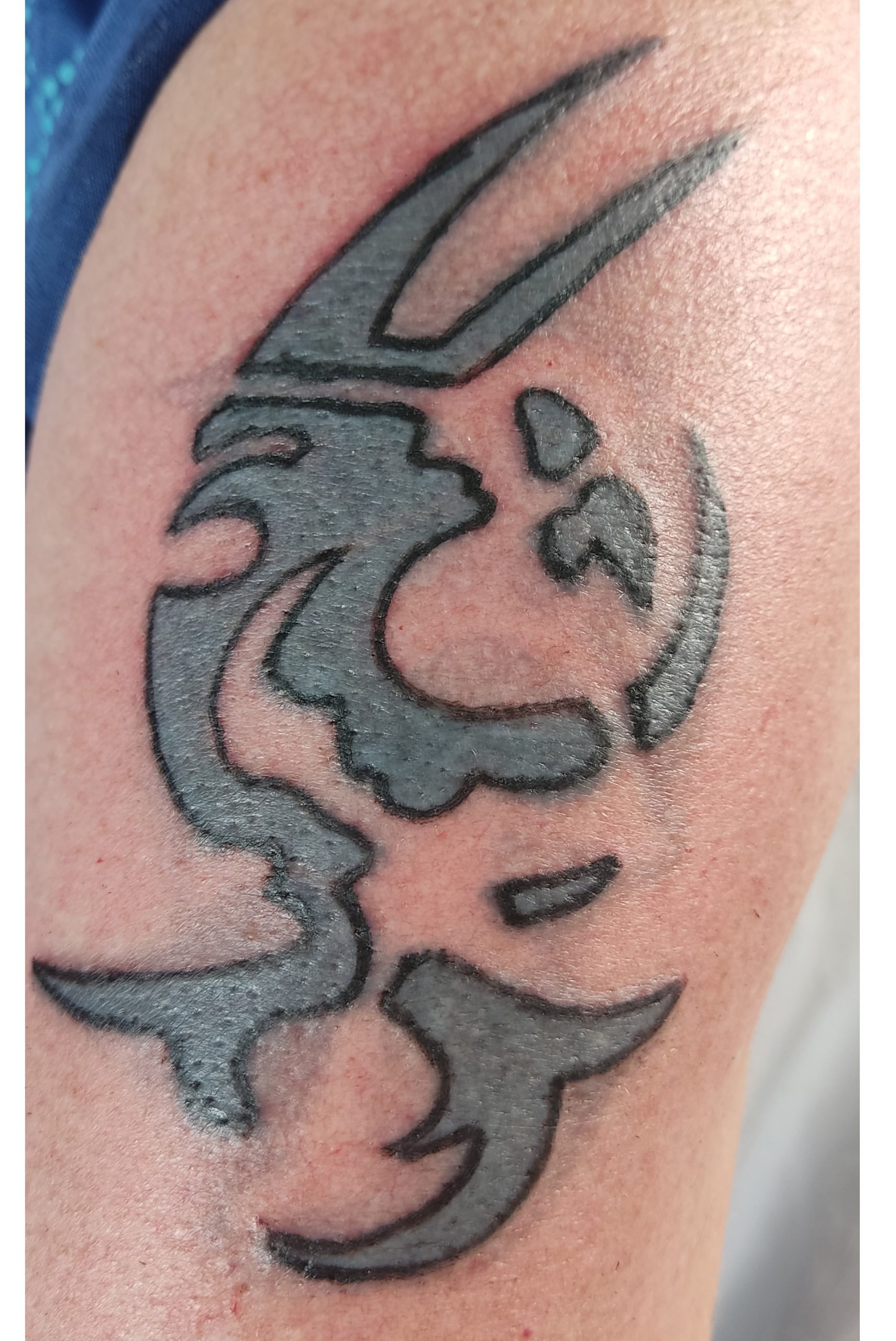Bijwerken van een oude tatoeage